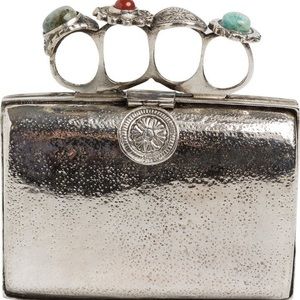 From St Xavier silver ring clutch